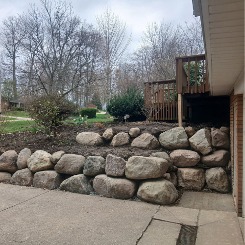 Boulder retaining wall